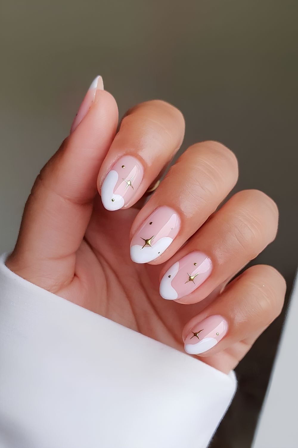 Snow-inspired French tips with chrome stars