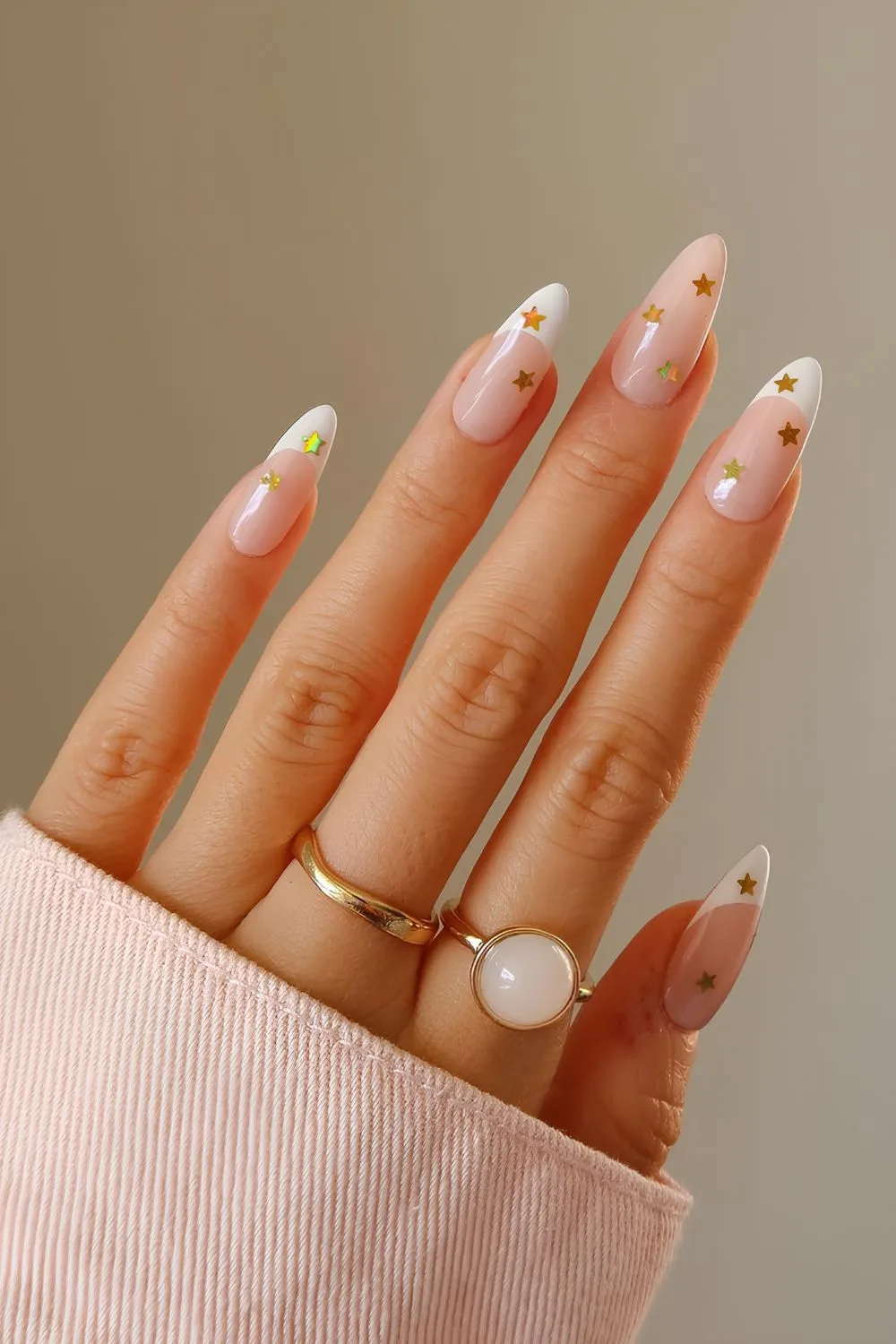 White French nails with gold stars