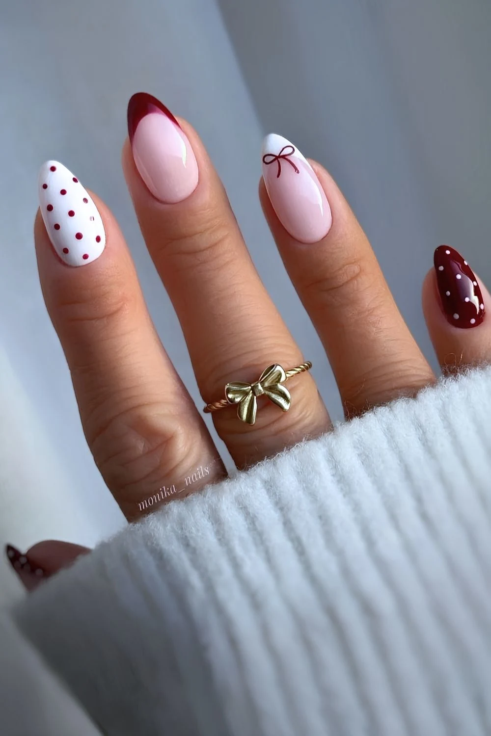 White and dark red nails with bows and polka dots