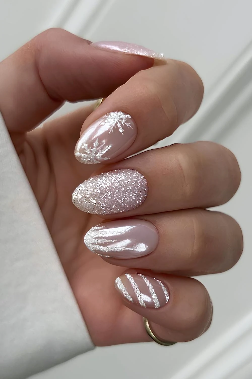 White chrome nails with frosty accent art