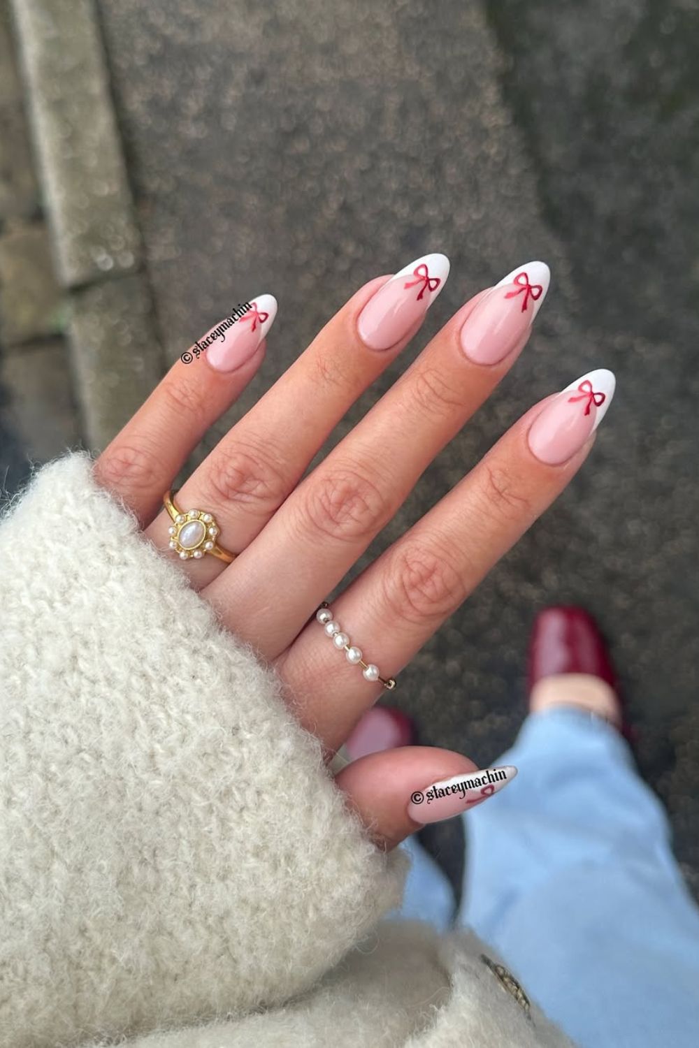 White french tip nails with red bows