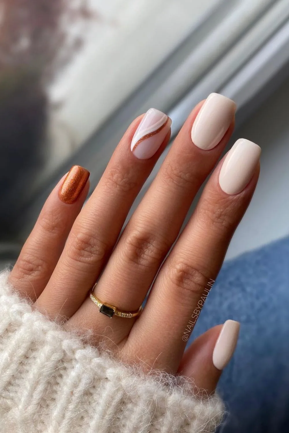 White nails with copper glitter accents