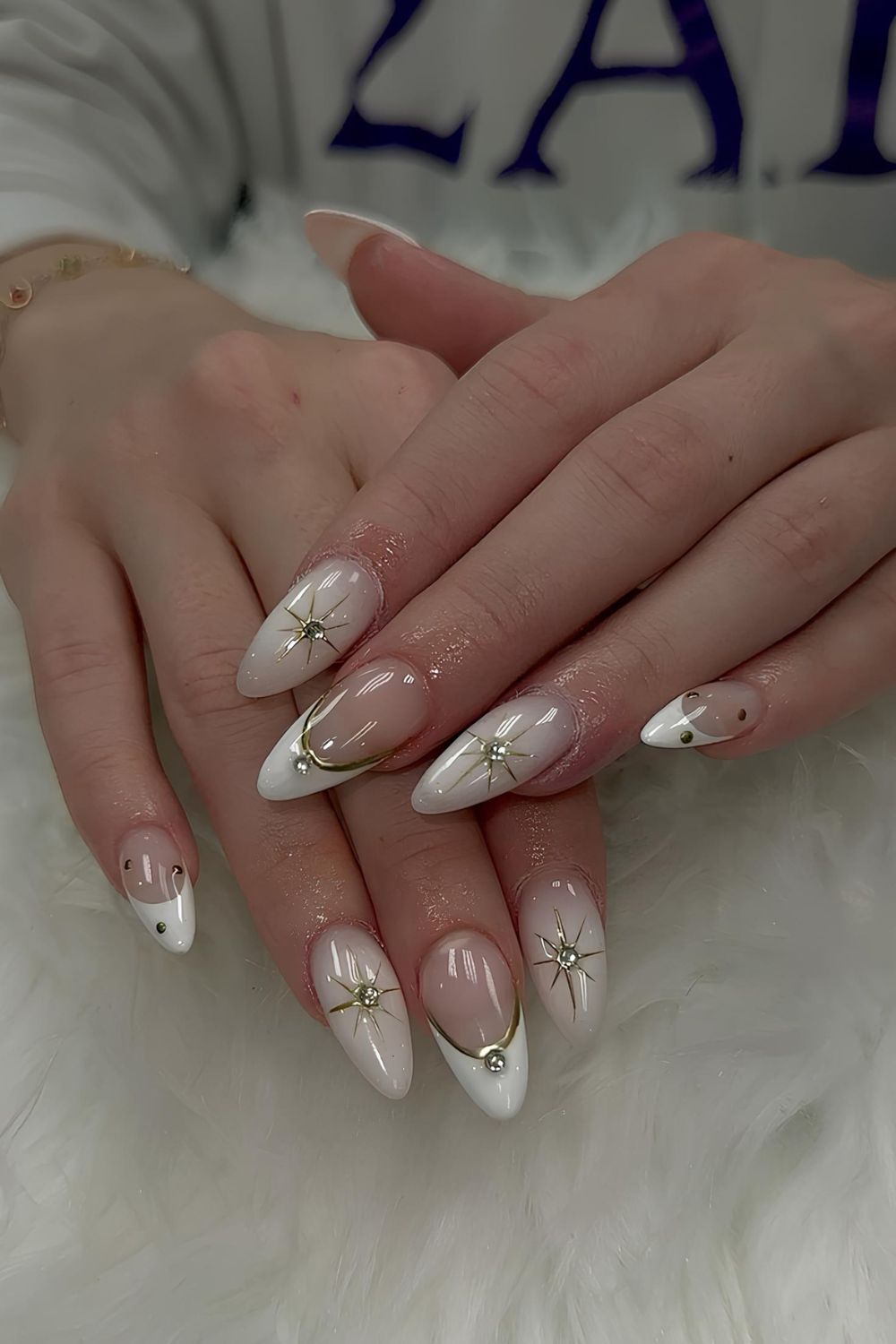 White nails with gold chrome accents