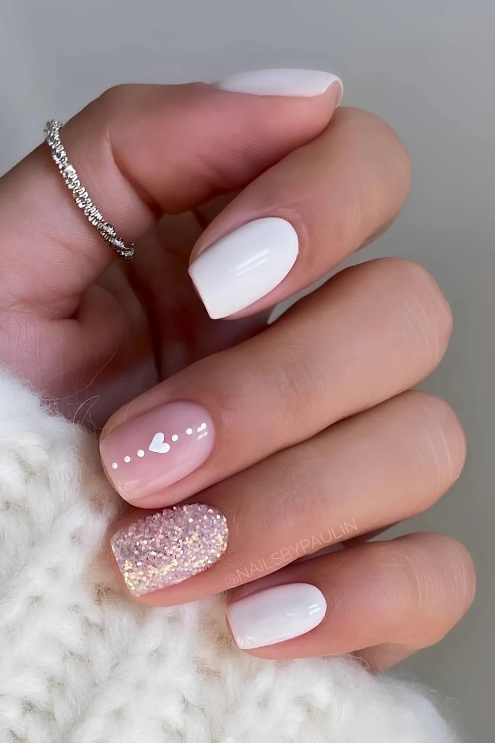 White nails with hearts and glitter