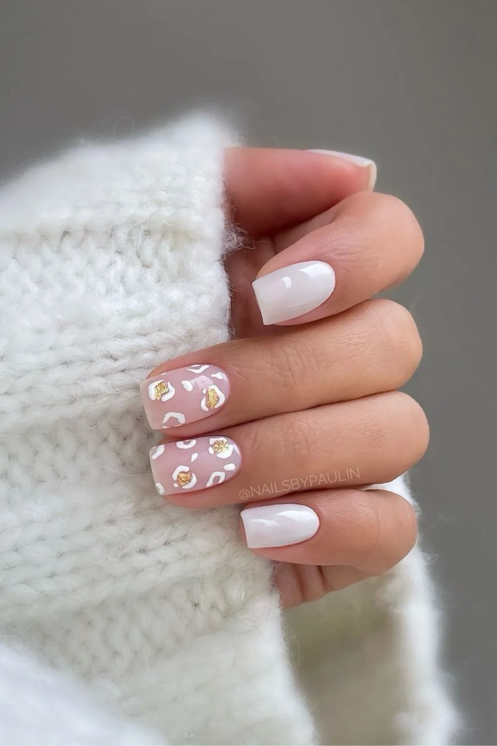 White nails with leopard spot accents