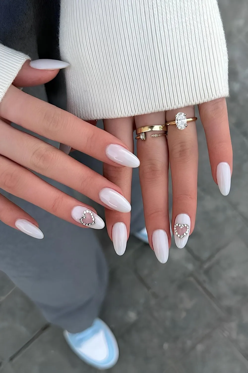 White nails with rhinestone hearts