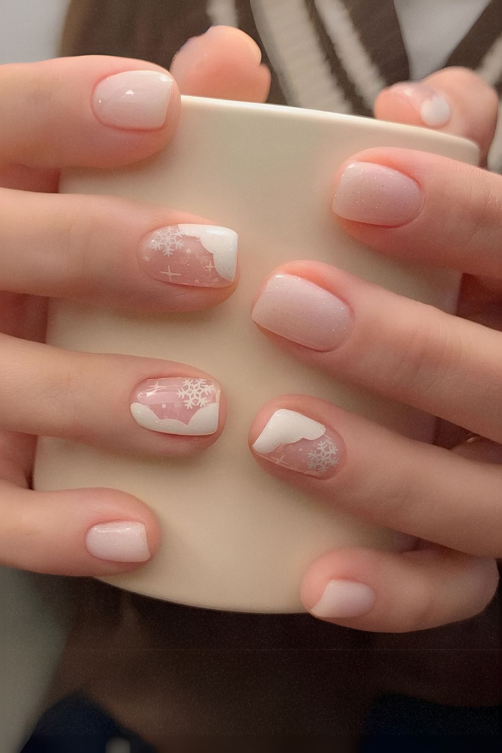 White nails with snow and snowflake art