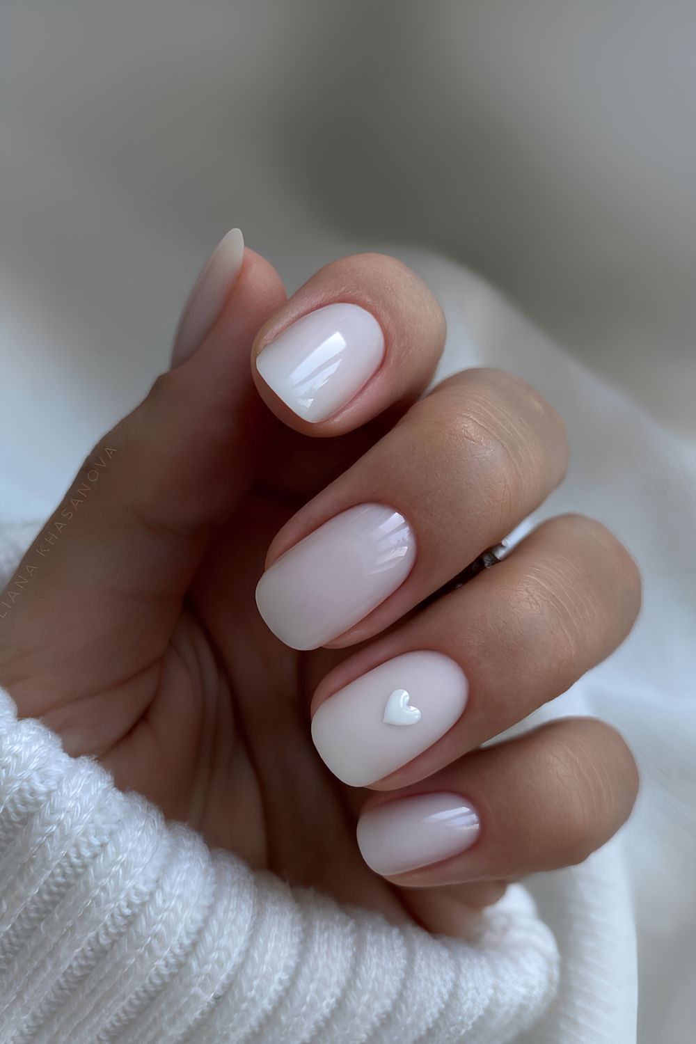 White nails with tiny heart accent