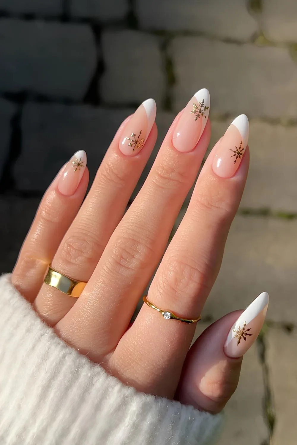 White side French nails with gold snowflakes