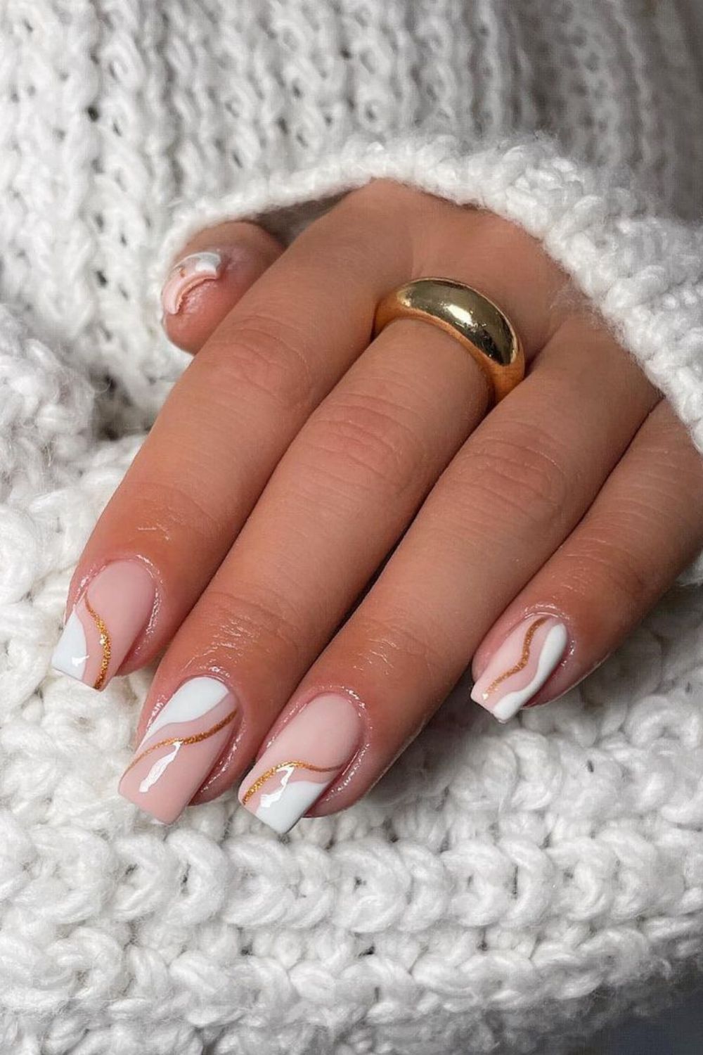 White winter nails with gold lines