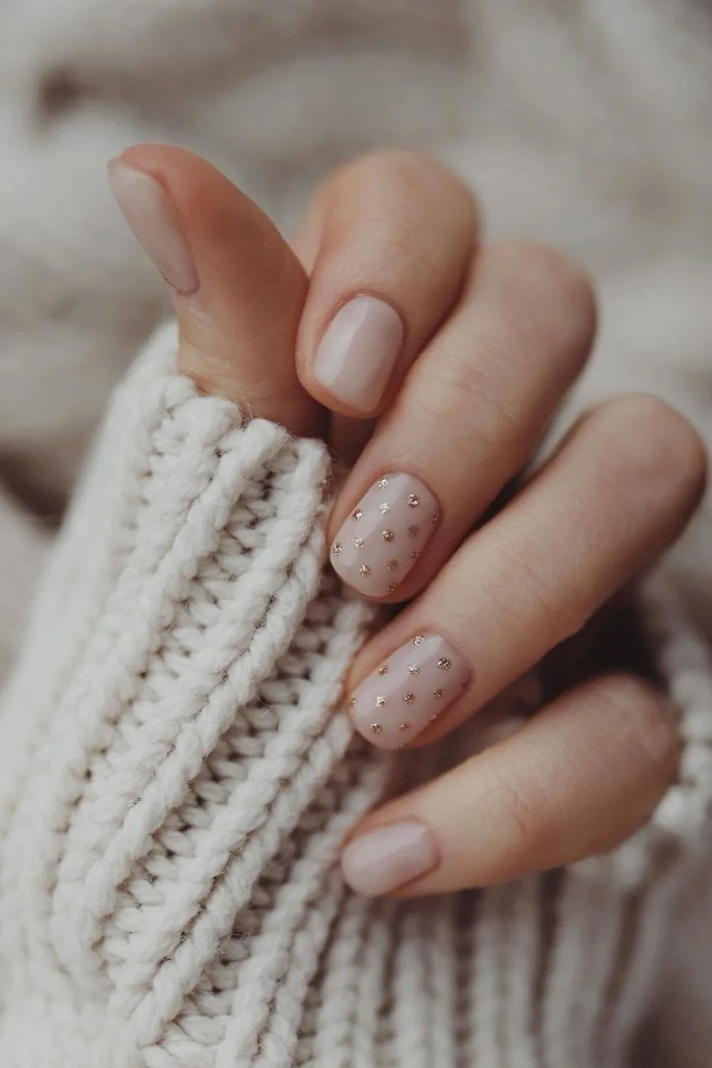 neutral nails with polka dot accents