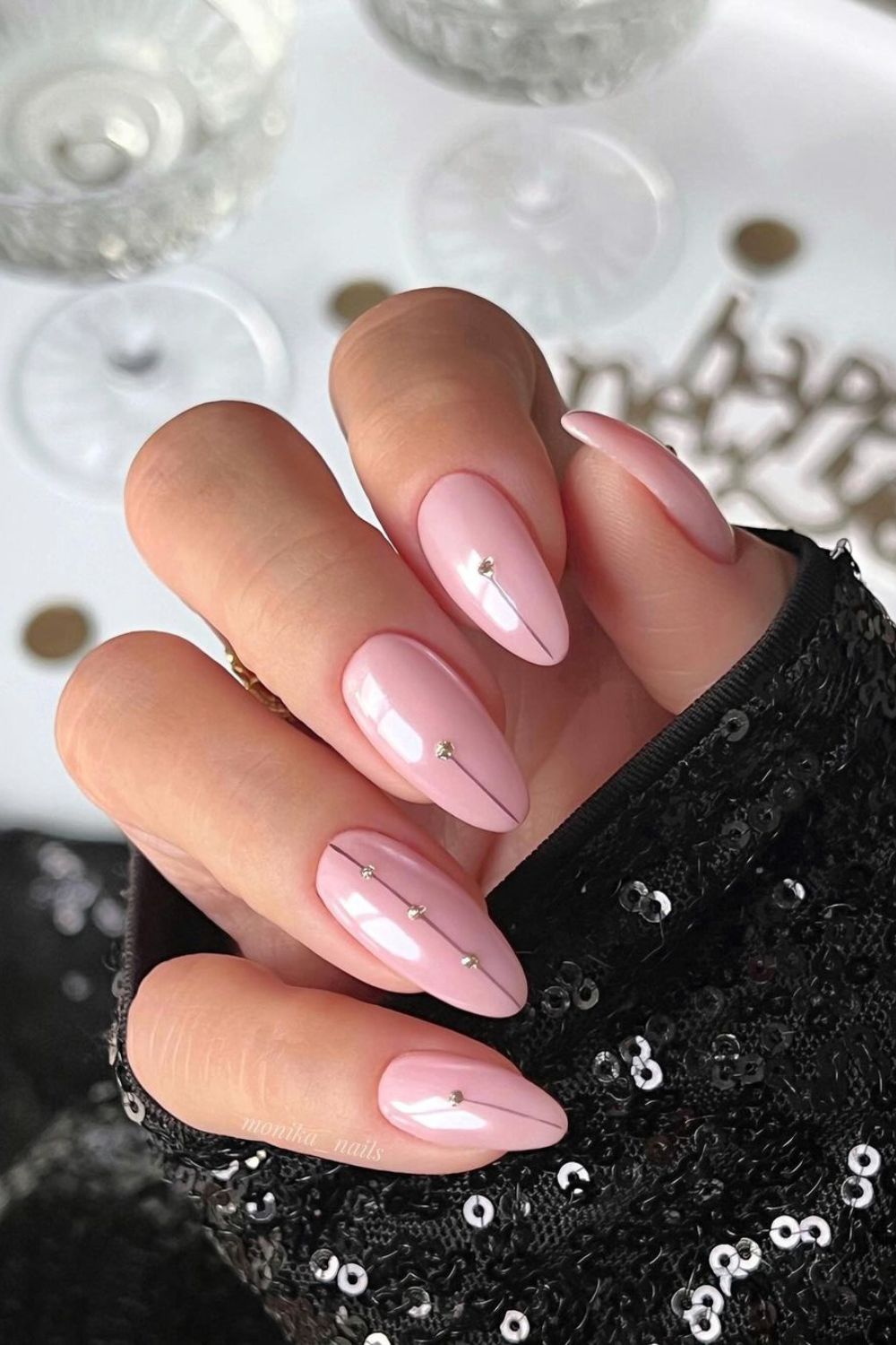 new year's soft pink nails with tiny crytslas