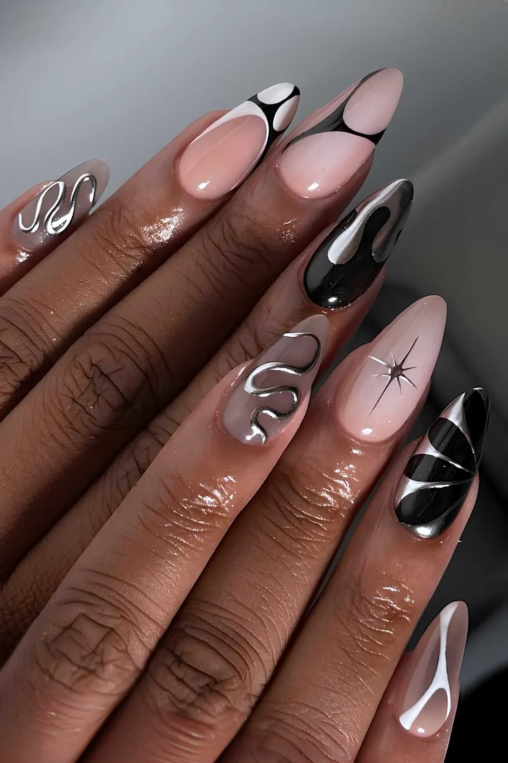 Abstract black and white mani with silver accents