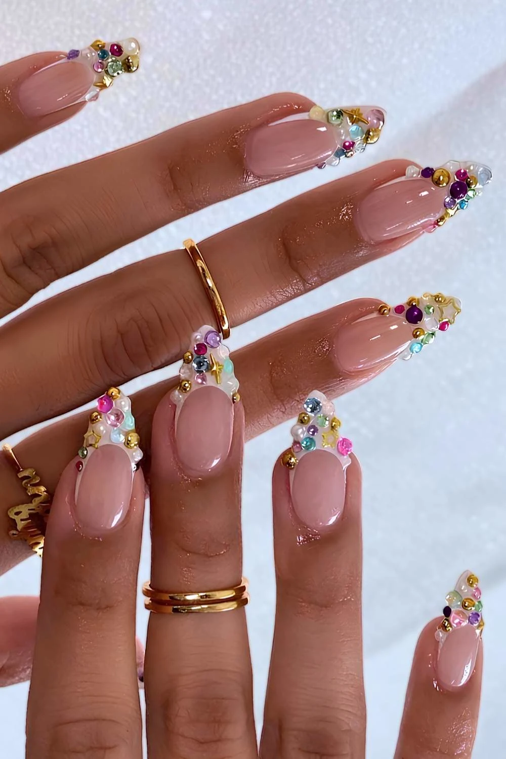 Bedazzled white French tip manicure