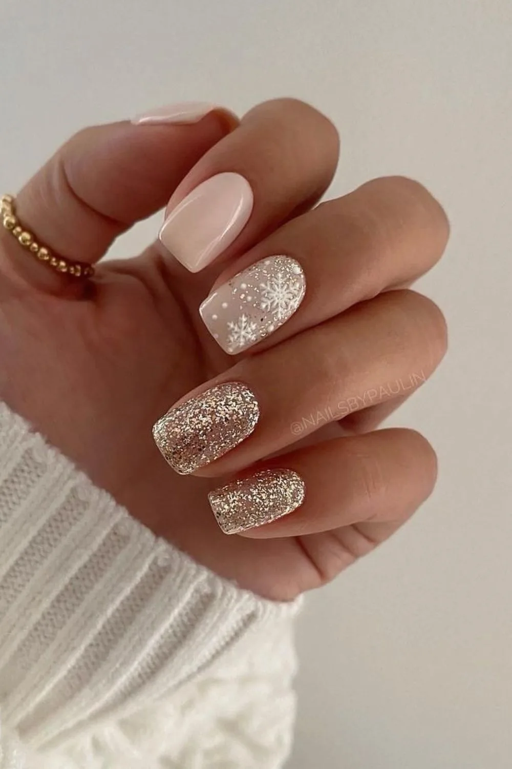 Beige glitter nails with snowflakes