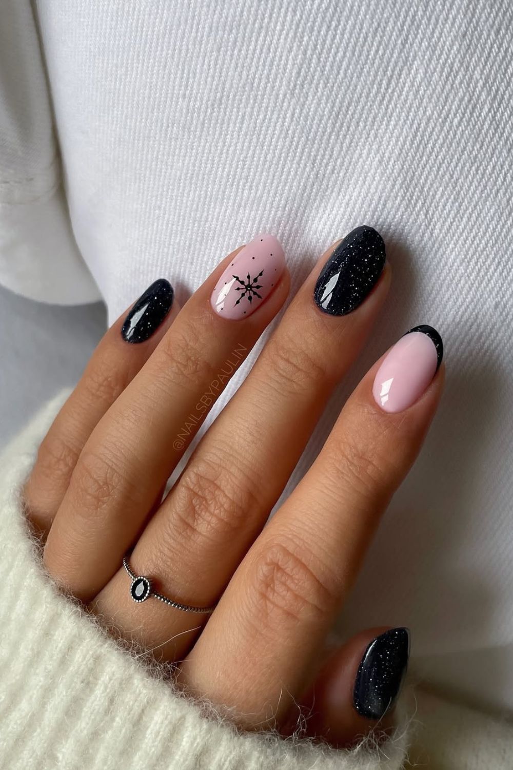 Black French manicure with glitter and snowflake