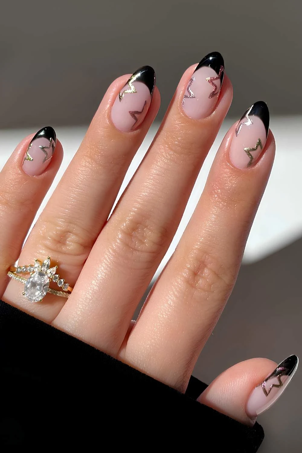 Black French manicure with silver star art