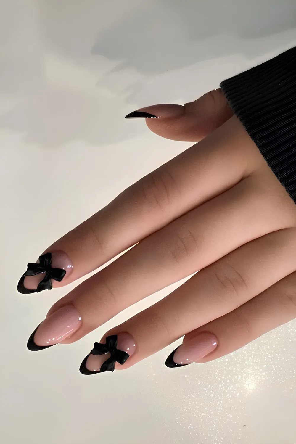 Black French nails with 3D bows