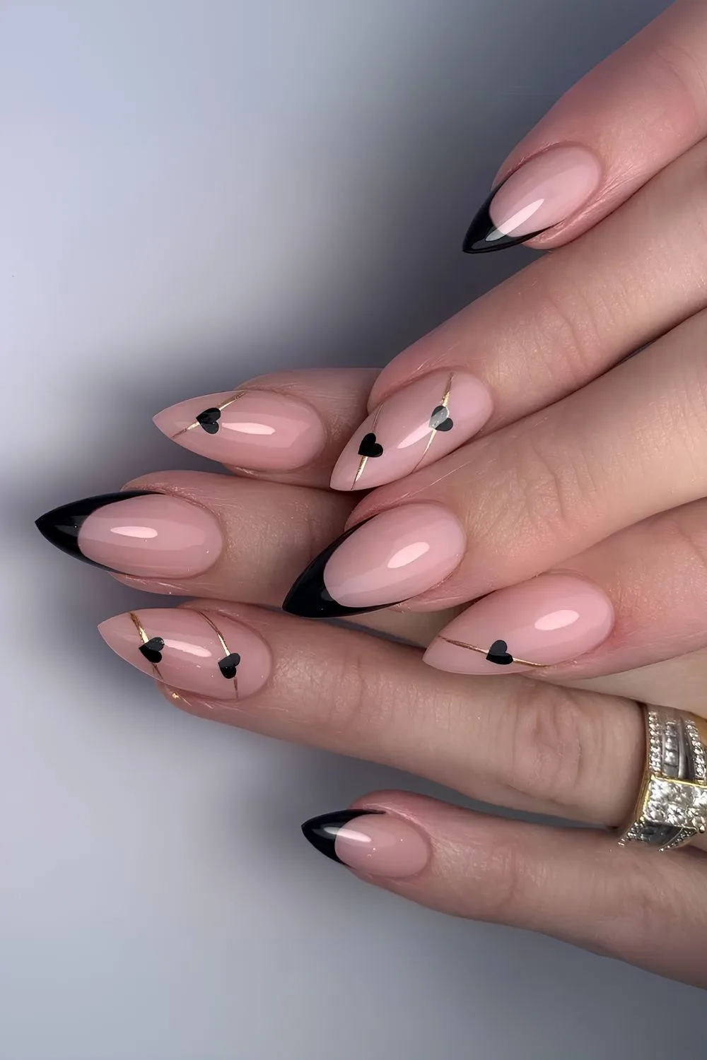 Black French nails with hearts and gold lines