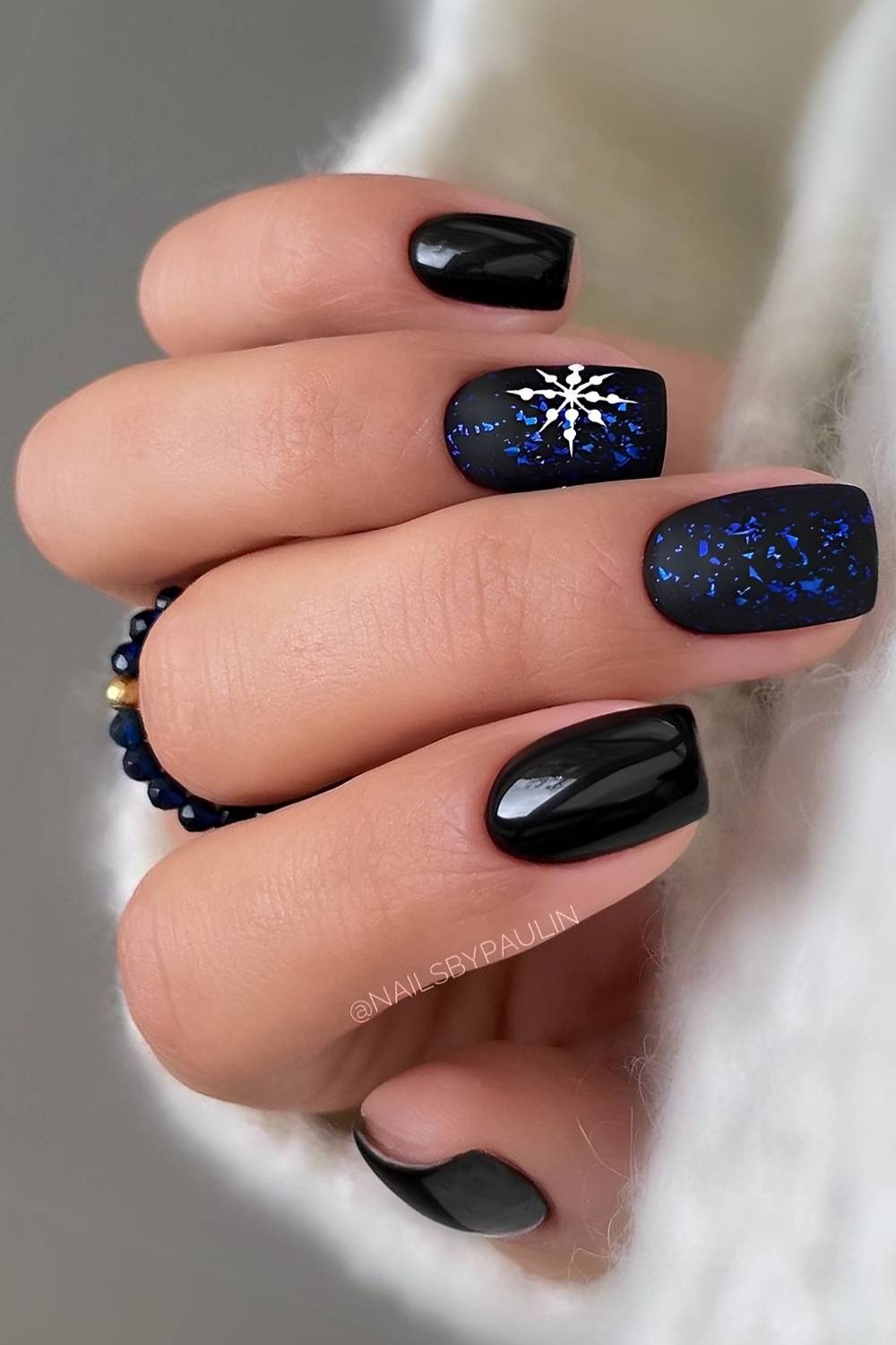 Black and blue mani with snowflakes