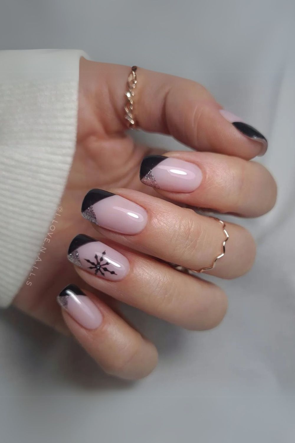 Black and silver nails with snowflakes