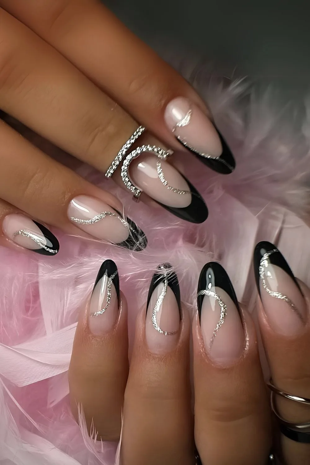 Black french nails with silver glitter swirls