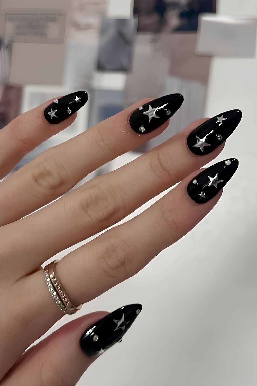 Black mani with silver chrome stars