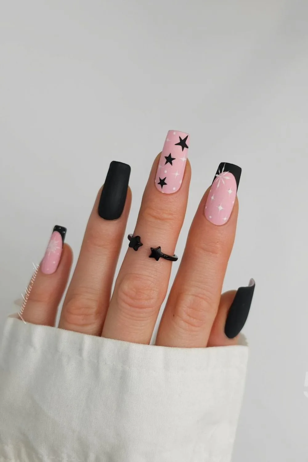 Black matte French tip nails with stars