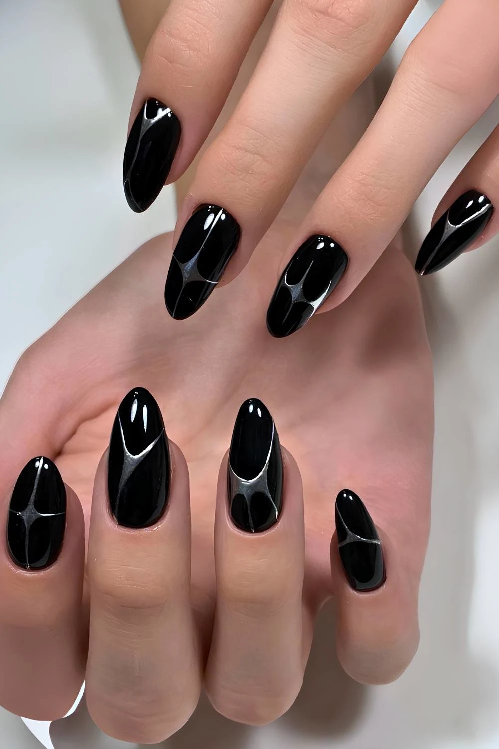 Black nails with abstract silver lines