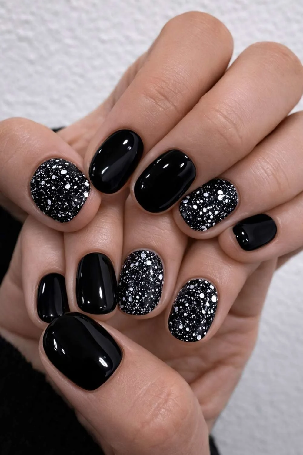 Black nails with chunky silver glitter