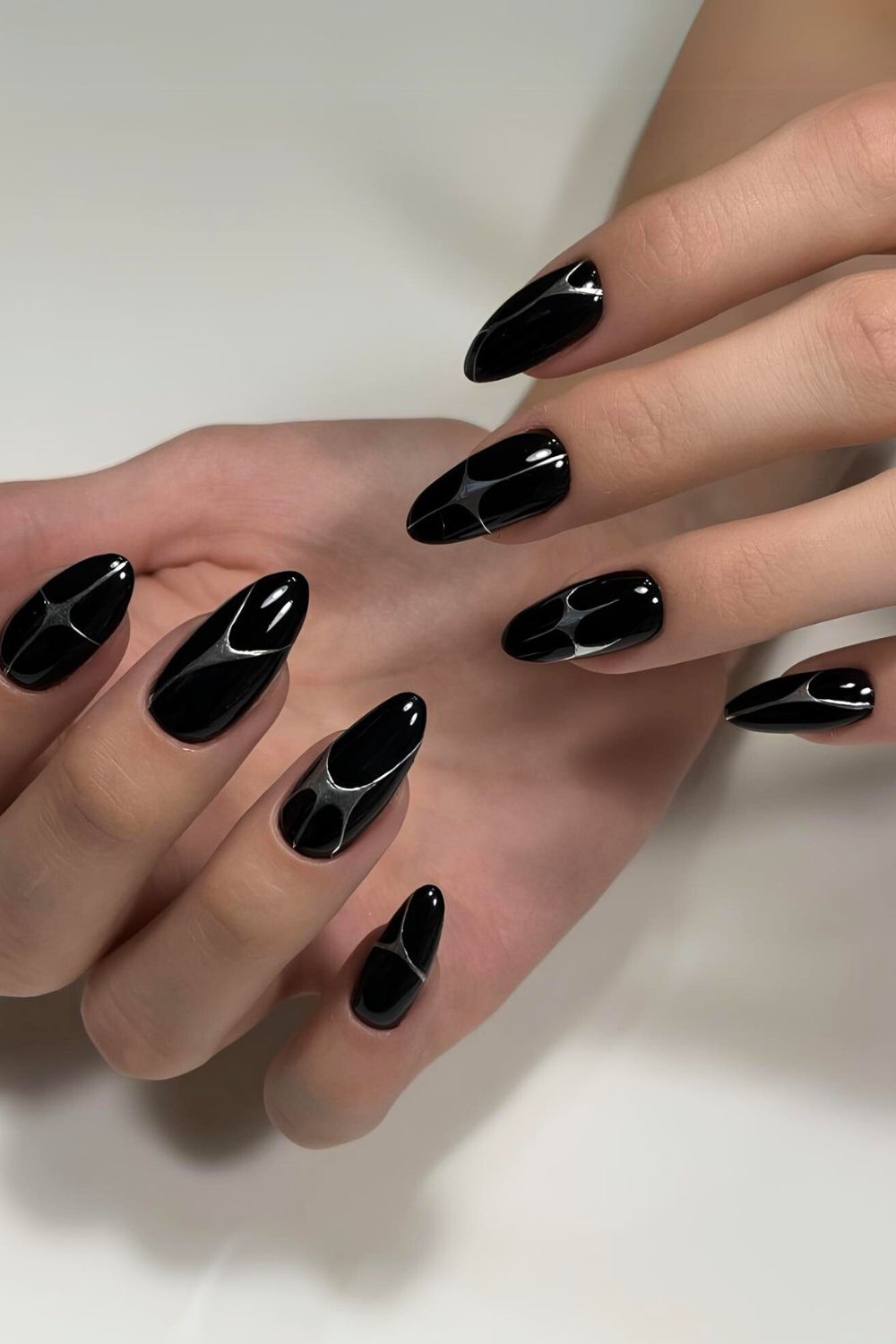 Black nails with silver chrome lines