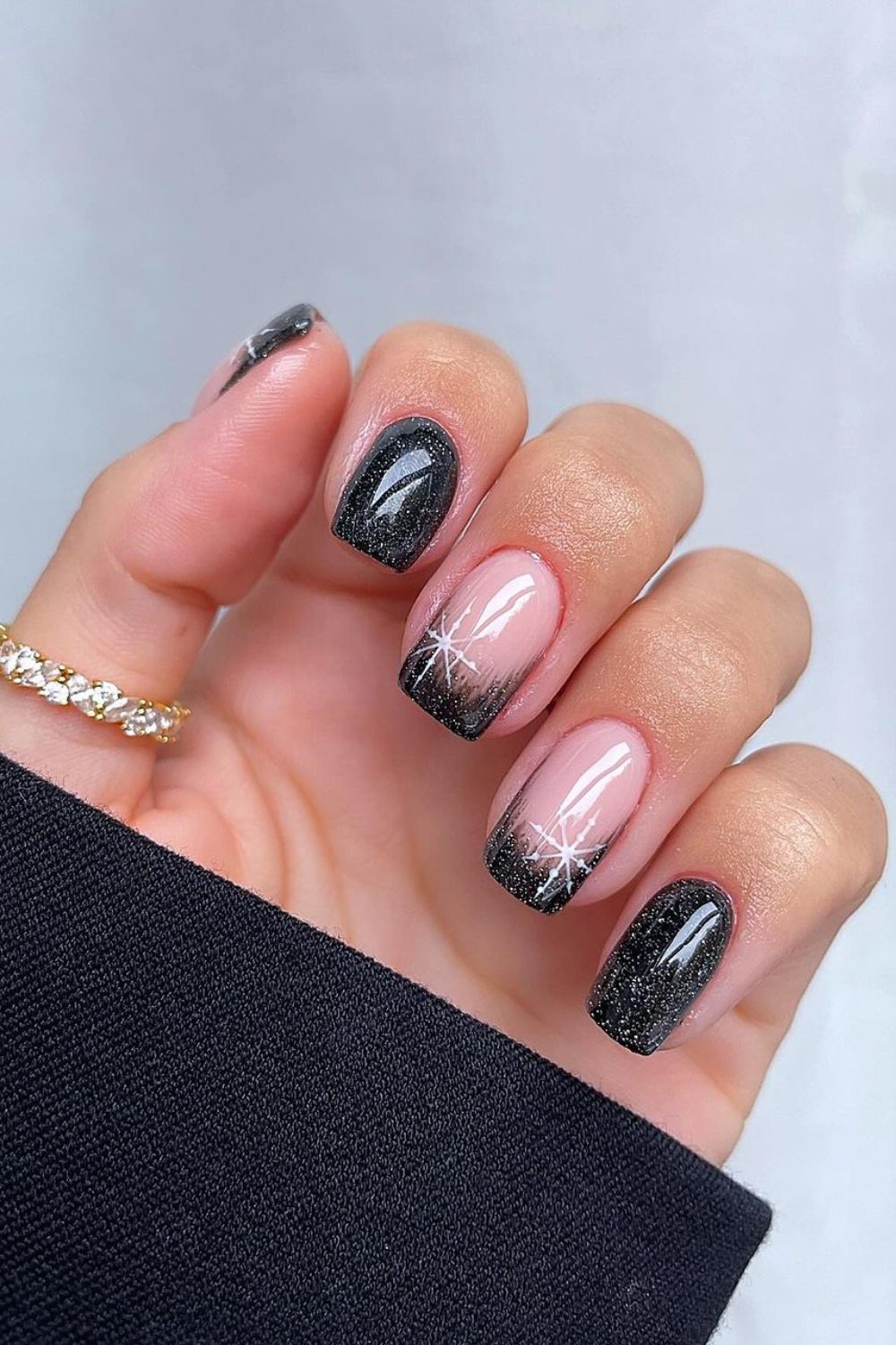 Black ombre French nails with snowflakes