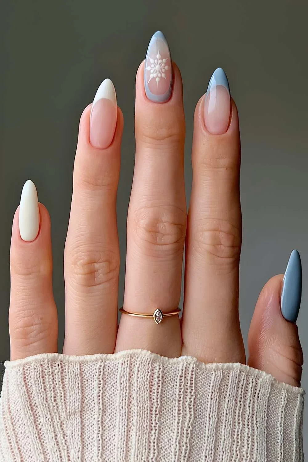 Blue and vanilla nails with snowflake art