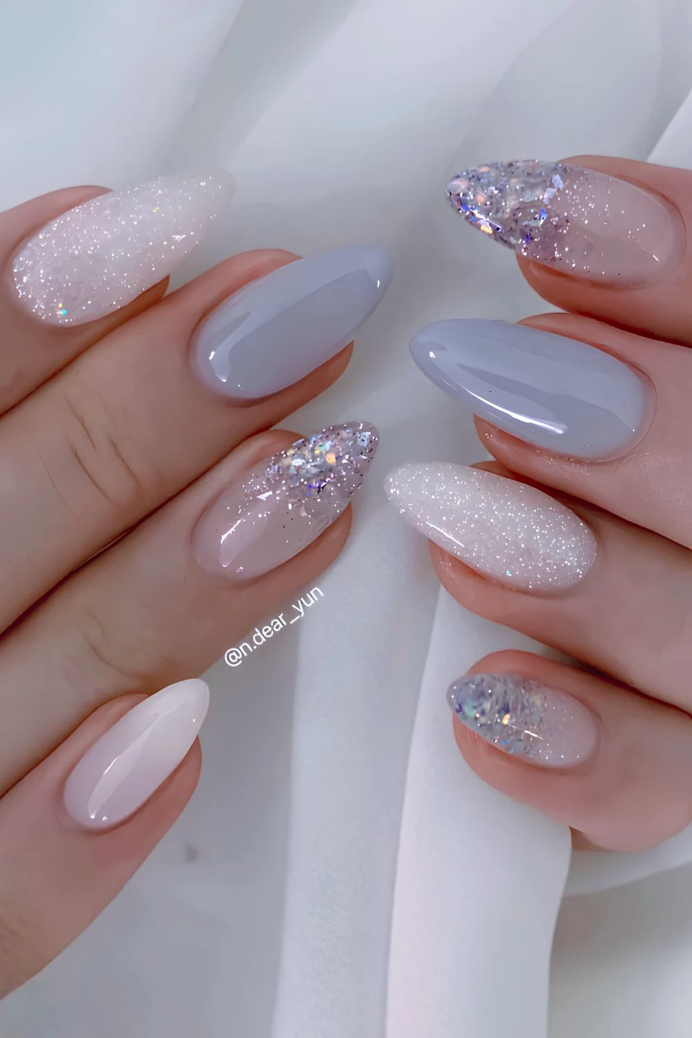 Blue and white nails with accent glitter