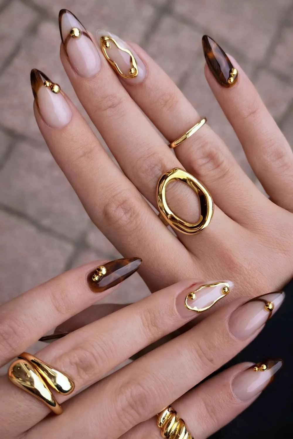Brown French mani with gold accents and tortie shell