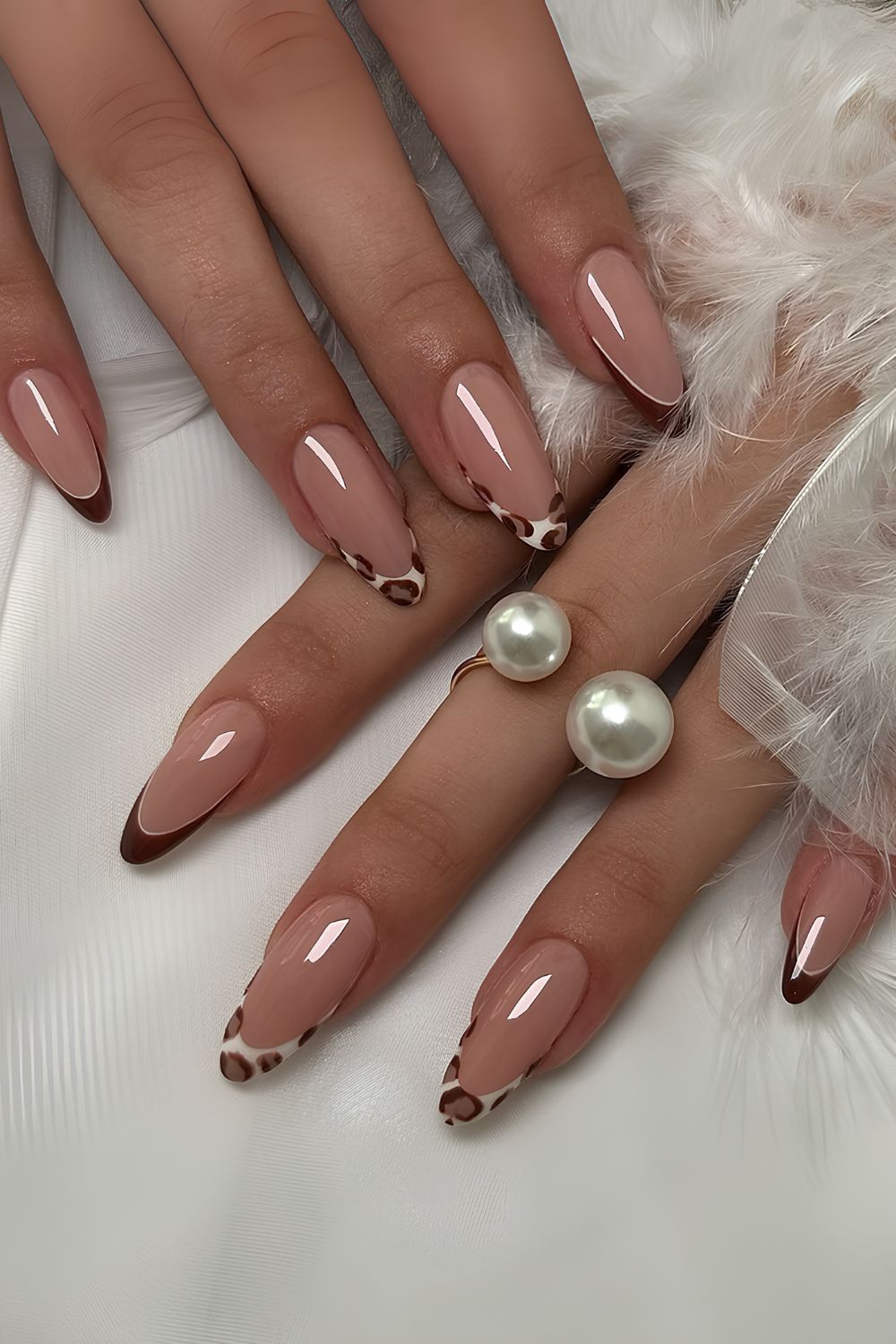 Brown French nails with leopard print accent