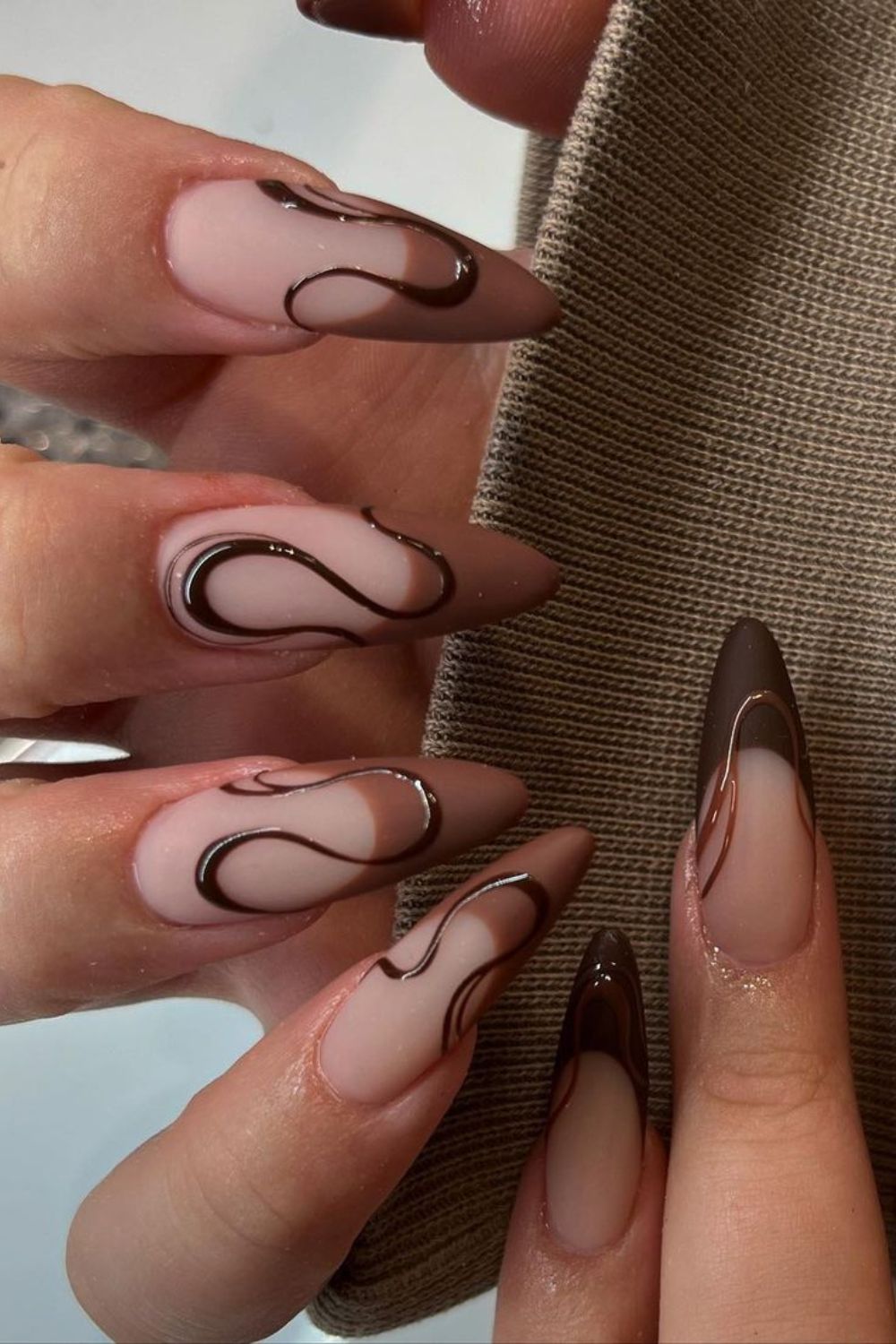 Brown French tip nails with funky lines