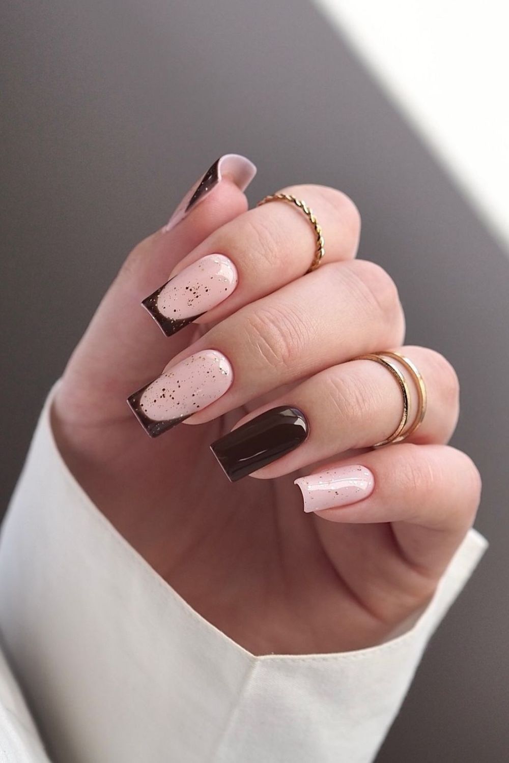 Brown French tip nails with glitter