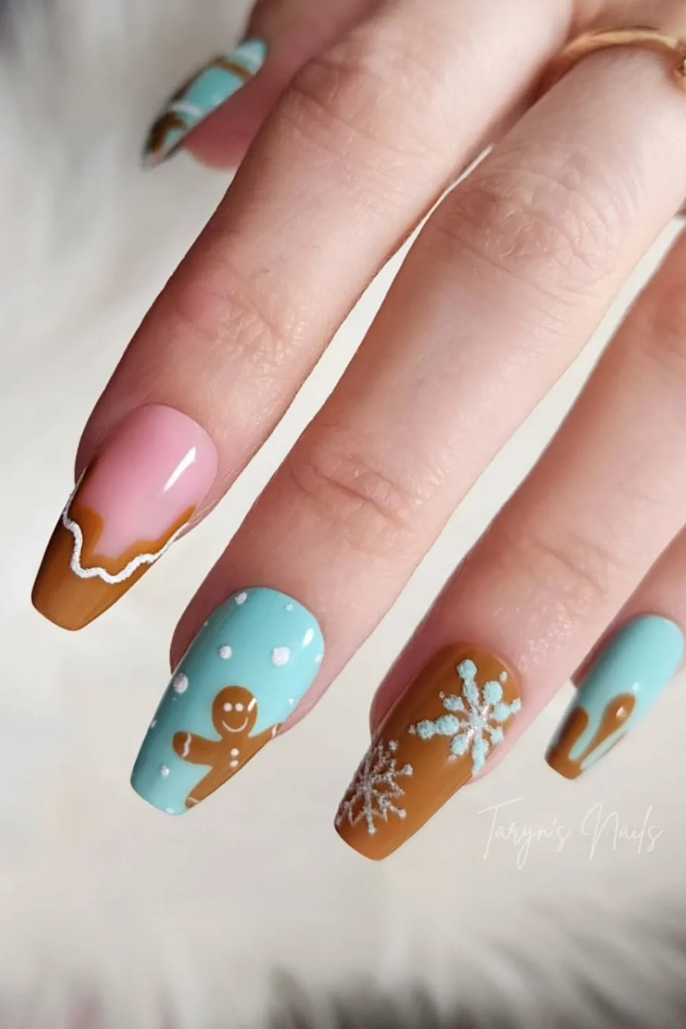 Brown and icy blue nails with gingerbread accent