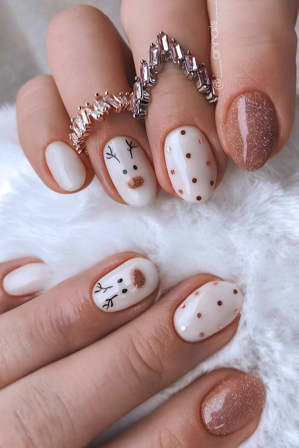 Brown and white nails with polka dots and reindeer art