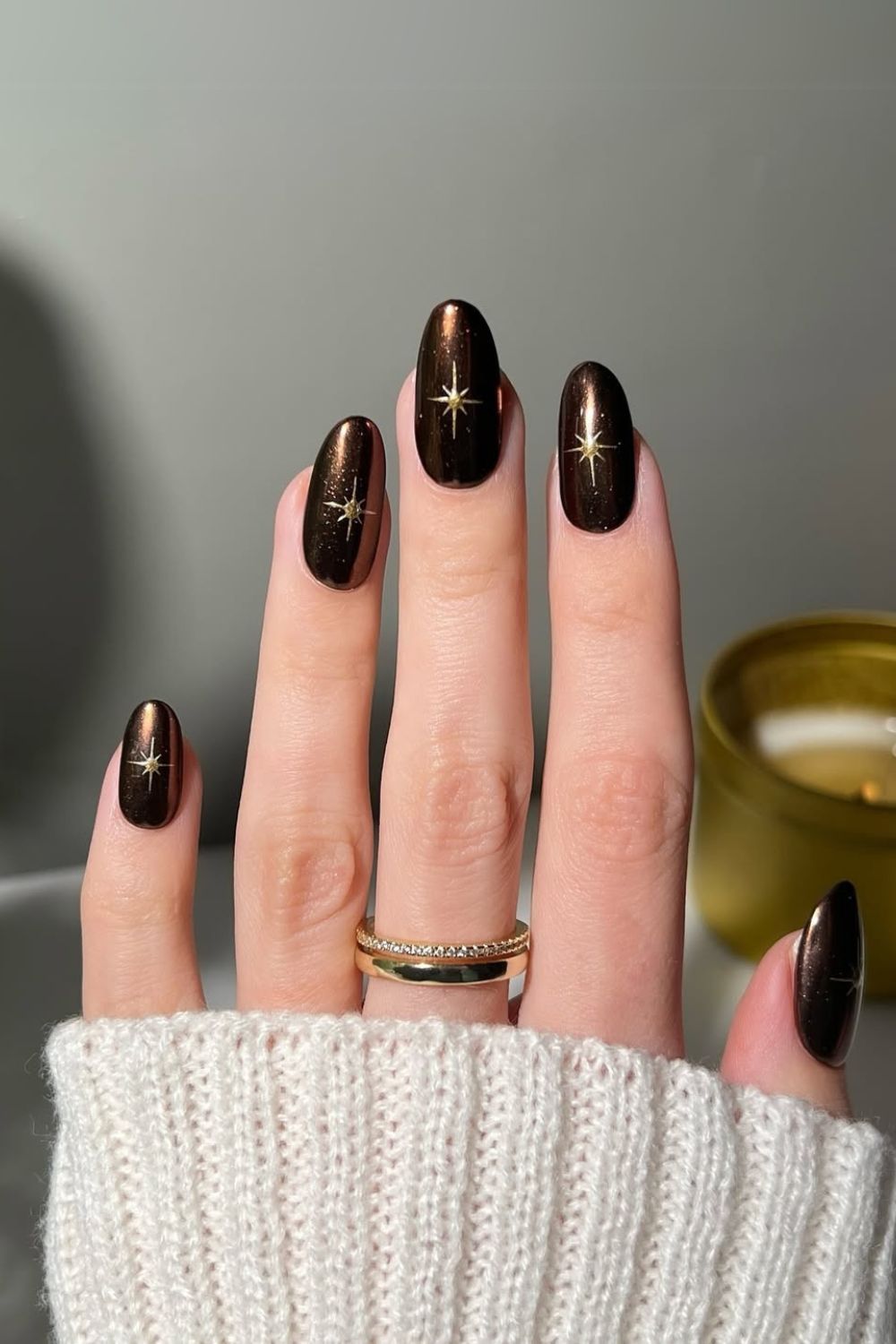 Brown nails with gold chrome stars