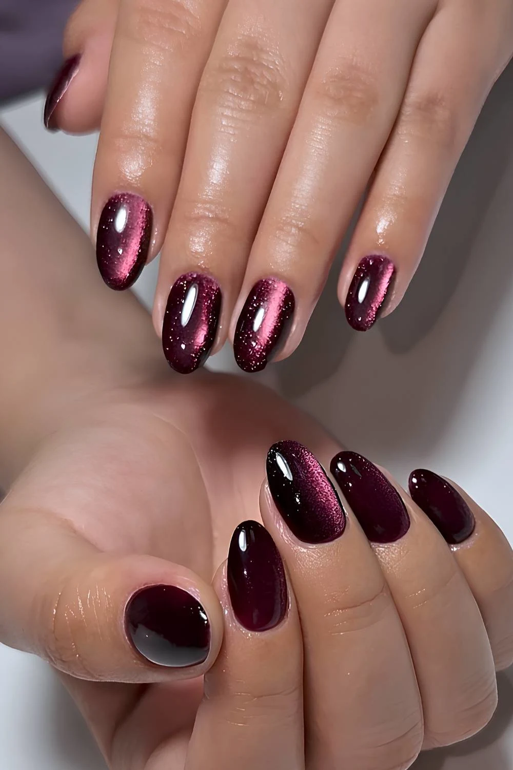 Burgundy cat eye nails