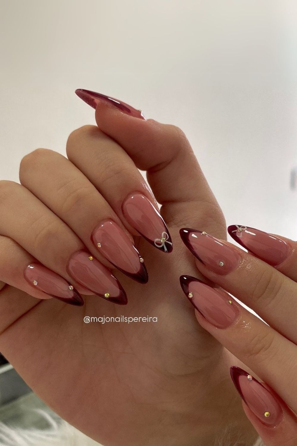 Cherry mocha nails with bows and gems