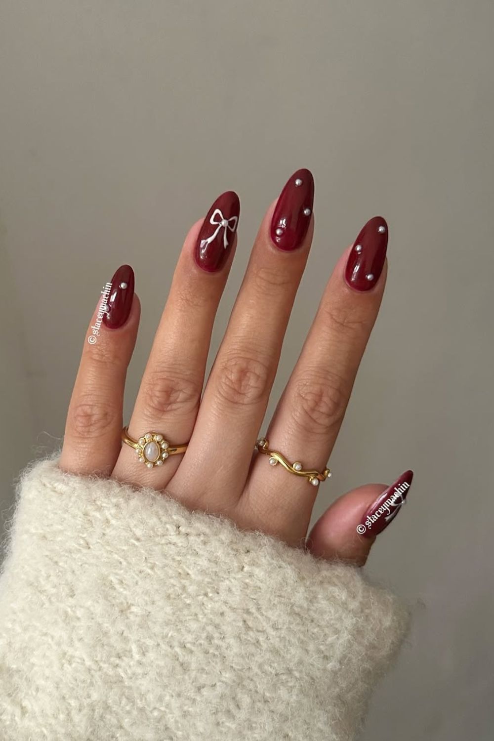 Cherry mocha nails with white bow and pearl accents