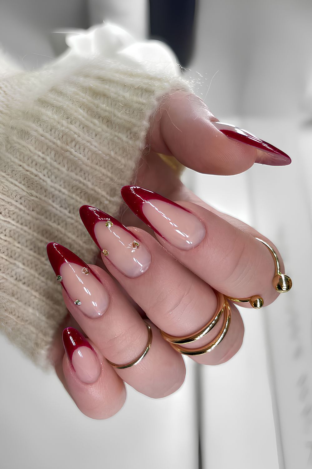 Cherry red French nails with rhinestones