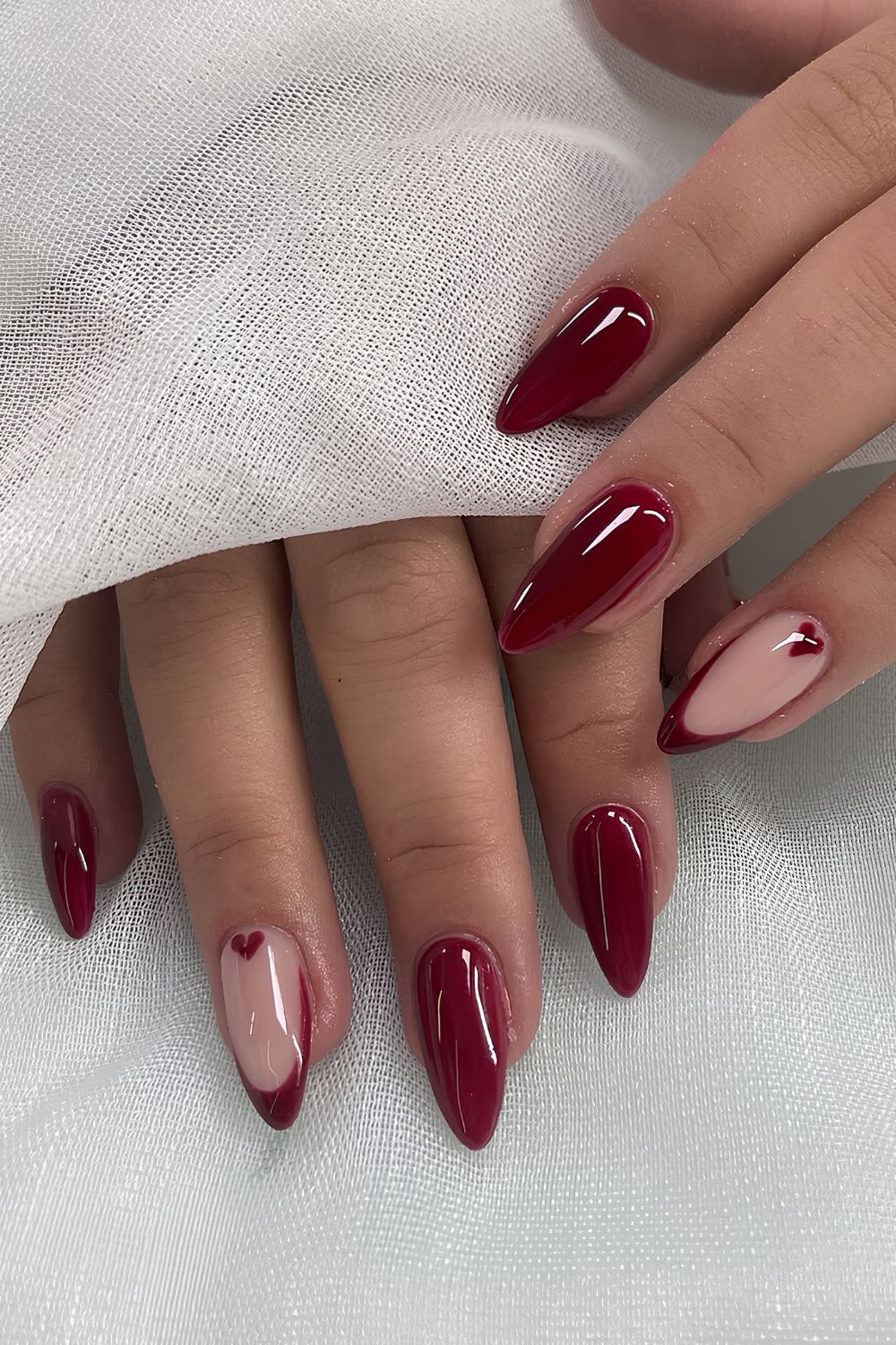 Cherry red nails with heart accent