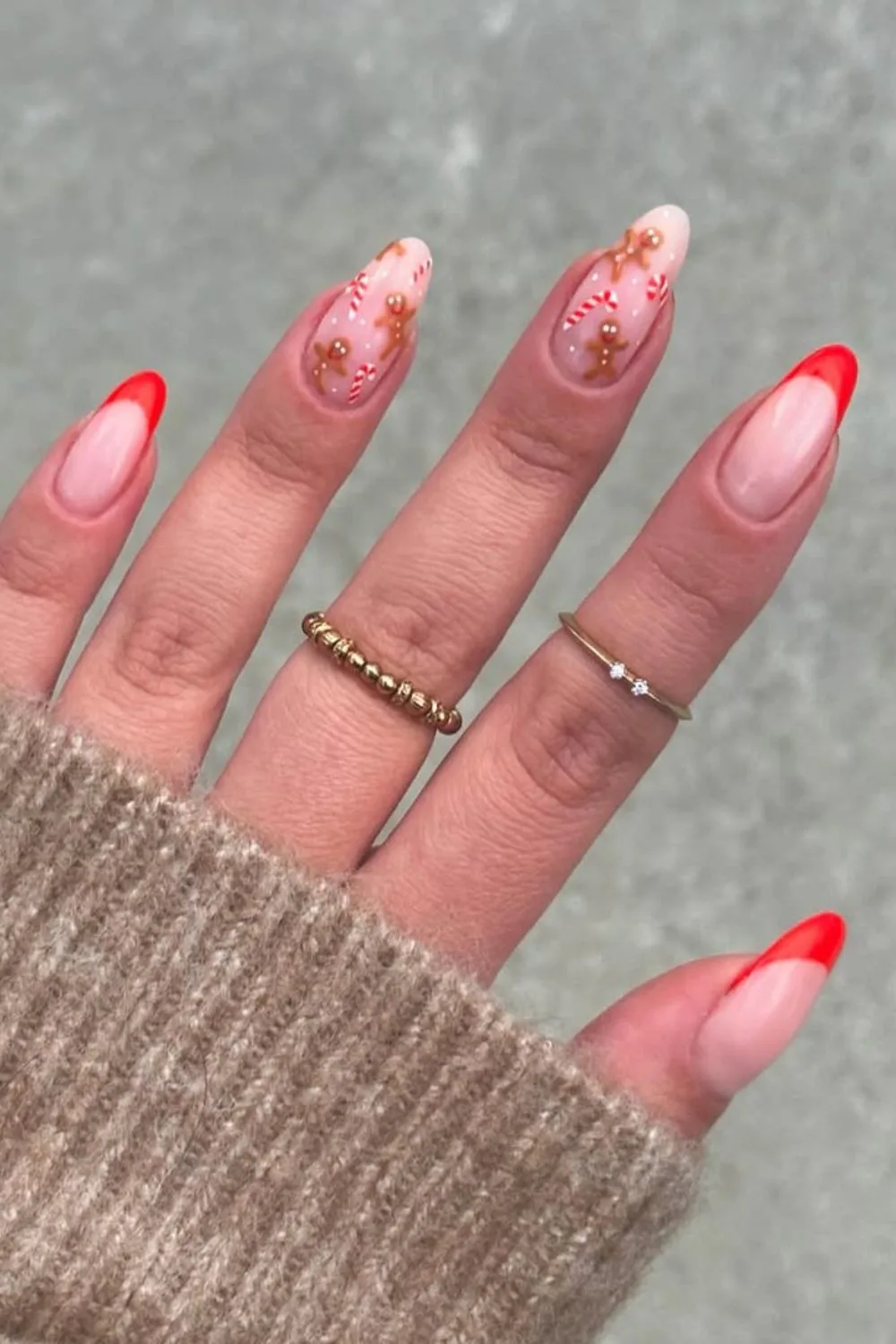 Classic red French tip nails with candy cane and gingerbread accents