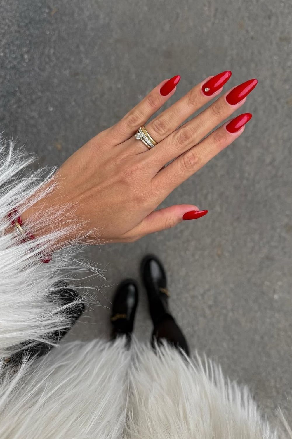 Classic red nails with pearl accent