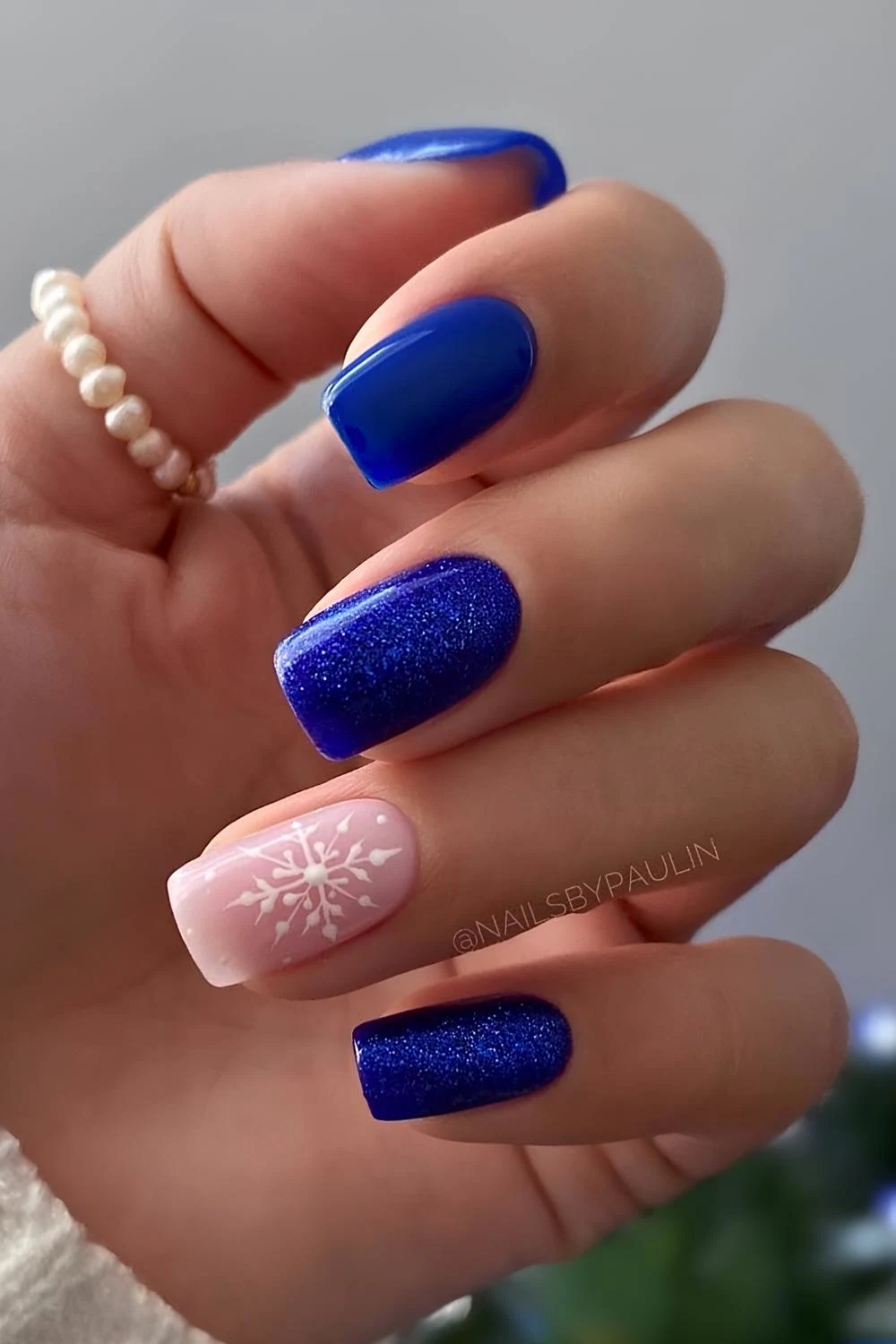 Cobalt blue nails with winter holiday art