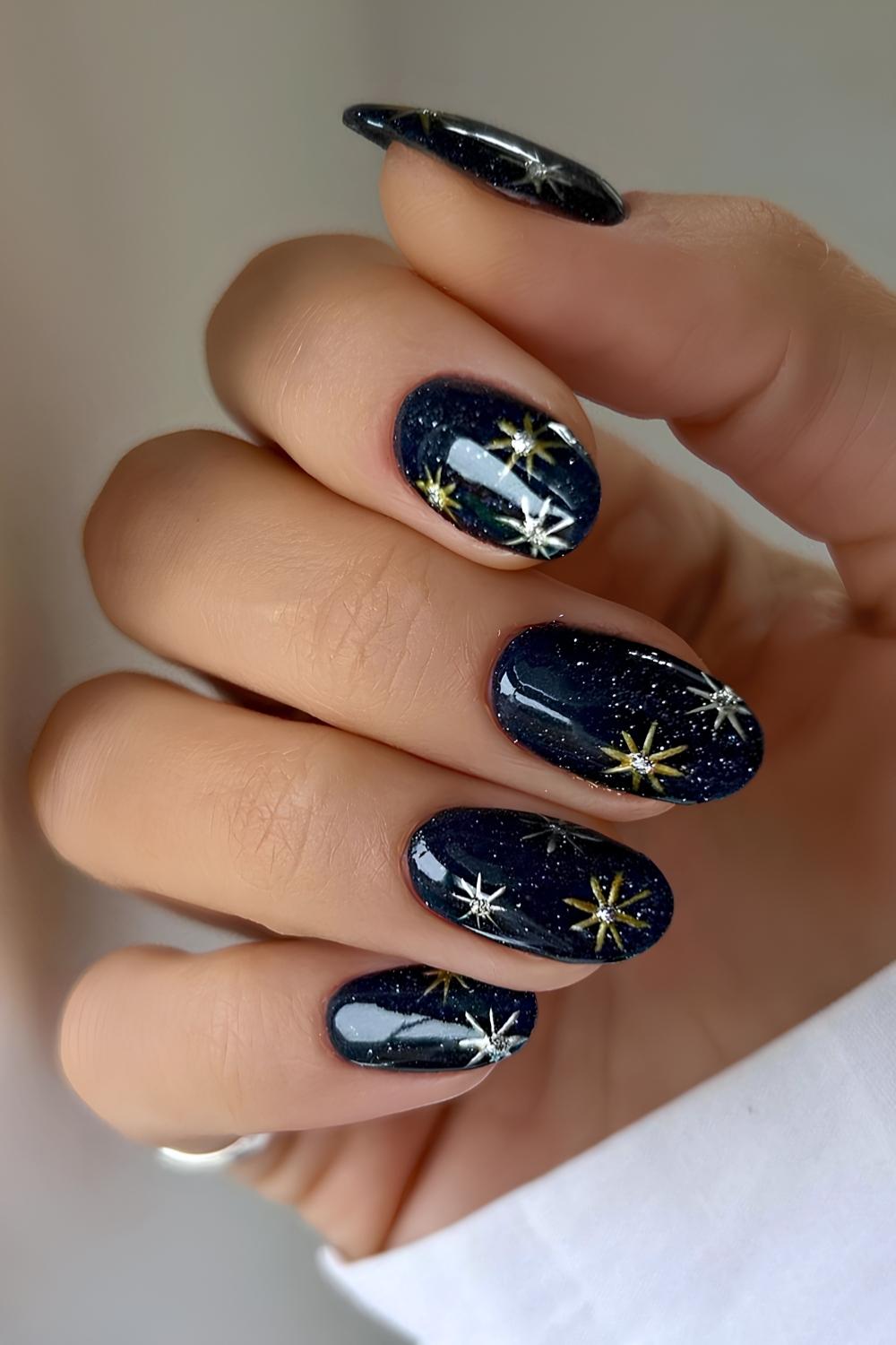 Dark blue winter nails with gold snowflakes